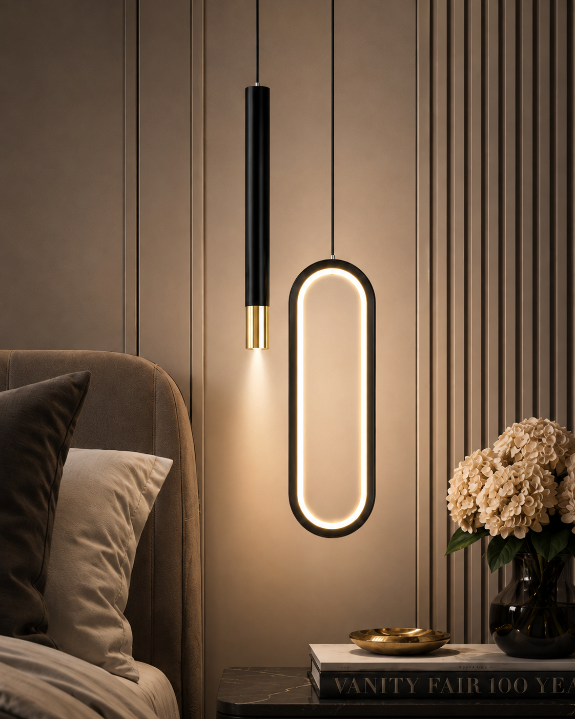 Lustre noir à deux foyers, ovale lumineux et tube suspendu, allumé au-dessus d'une table de chevet