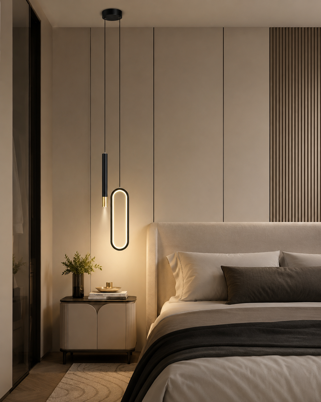 Lustre noir ovale et tube LED installé en tête de lit, diffusant une lumière chaude sur le mur